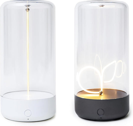 UrbanBaazar minimalist table lamp with sleek design, featuring a modern cylindrical base and soft fabric shade on a wooden table.