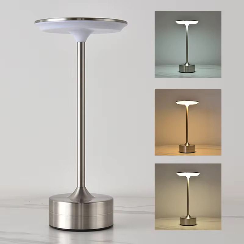 UrbanBaazar electric tabletop lamp with a modern design, featuring a sleek base and a cylindrical lampshade.
