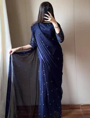 Women’s UrbanBaazar chiffon saree featuring sequins and embroidery in a vibrant draped style, showcasing elegant stitching.