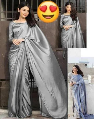 Two pieces of UrbanBaazar women's shamoz silk plain stitched sarees in elegant colors draped elegantly on a mannequin.