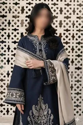 Three-piece women's unstitched embroidered suit by UrbanBaazar featuring intricate designs and vibrant colors.